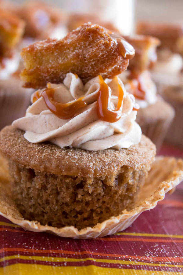 Take your favourite cinnamon/sugar treat and turn it into cupcakes! These Dulce de Leche Churro Cupcakes are a must for Cinco de Mayo! Soft and fluffy cinnamon cupcakes, filled with gooey dulce de leche, dipped in cinnamon sugar, topped with cinnamon buttercream and a dulce de leche filled churro!