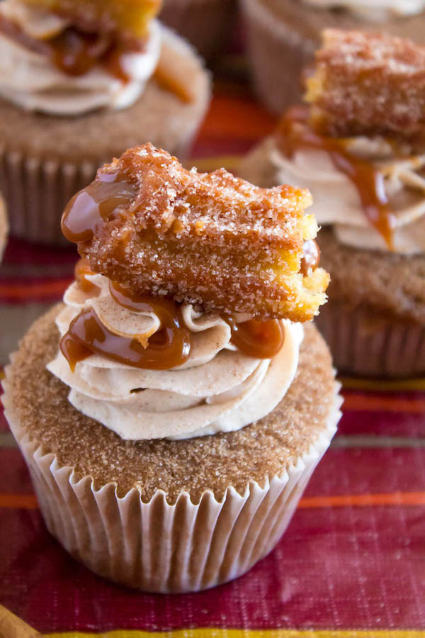 Take your favourite cinnamon/sugar treat and turn it into cupcakes! These Dulce de Leche Churro Cupcakes are a must for Cinco de Mayo! Soft and fluffy cinnamon cupcakes, filled with gooey dulce de leche, dipped in cinnamon sugar, topped with cinnamon buttercream and a dulce de leche filled churro!