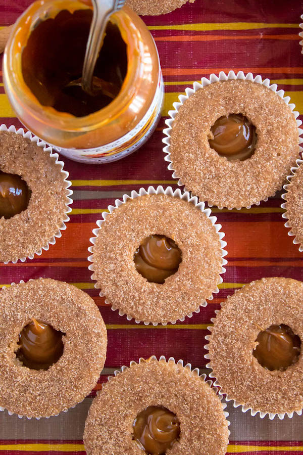 Take your favourite cinnamon/sugar treat and turn it into cupcakes! These Dulce de Leche Churro Cupcakes are a must for Cinco de Mayo! Soft and fluffy cinnamon cupcakes, filled with gooey dulce de leche, dipped in cinnamon sugar, topped with cinnamon buttercream and a dulce de leche filled churro!