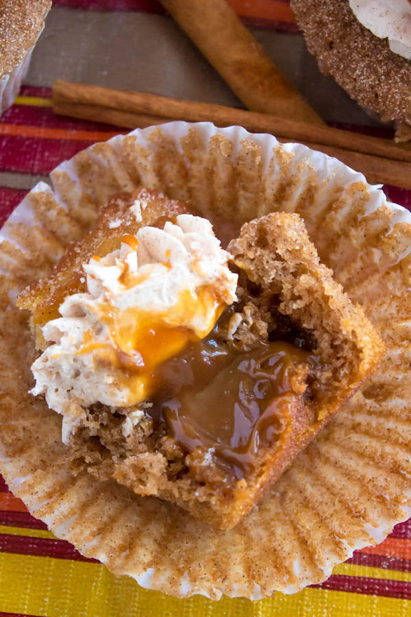 Take your favourite cinnamon/sugar treat and turn it into cupcakes! These Dulce de Leche Churro Cupcakes are a must for Cinco de Mayo! Soft and fluffy cinnamon cupcakes, filled with gooey dulce de leche, dipped in cinnamon sugar, topped with cinnamon buttercream and a dulce de leche filled churro!