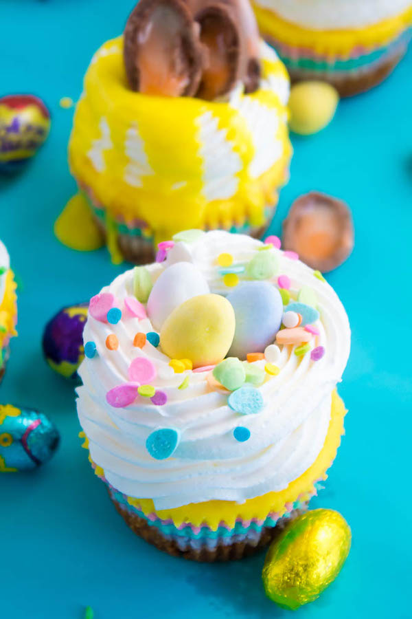 These Mini Easter Cheesecakes are a colourful, fun, festive Easter and Spring treat! Creamy, pastel layered mini cheesecakes topped with yummy Easter candy!