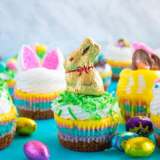 These Mini Easter Cheesecakes are a colourful, fun, festive Easter and Spring treat! Creamy, pastel layered mini cheesecakes topped with yummy Easter candy!