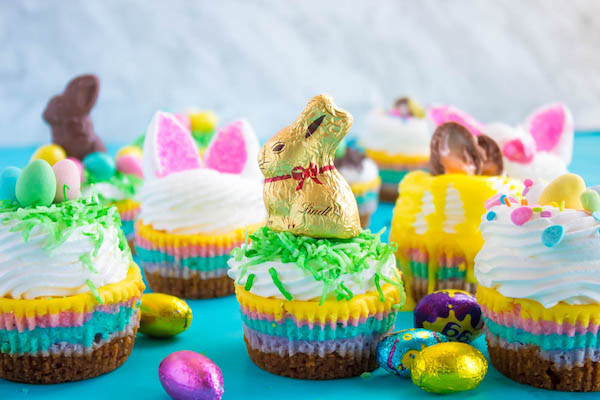 These Mini Easter Cheesecakes are a colourful, fun, festive Easter and Spring treat! Creamy, pastel layered mini cheesecakes topped with yummy Easter candy!