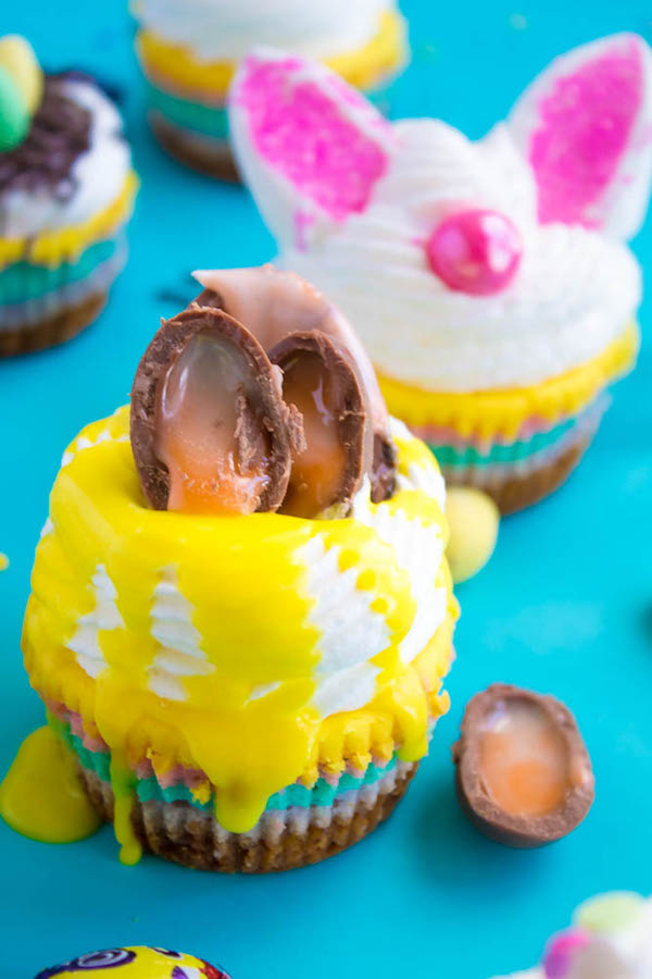 These Mini Easter Cheesecakes are a colourful, fun, festive Easter and Spring treat! Creamy, pastel layered mini cheesecakes topped with yummy Easter candy!