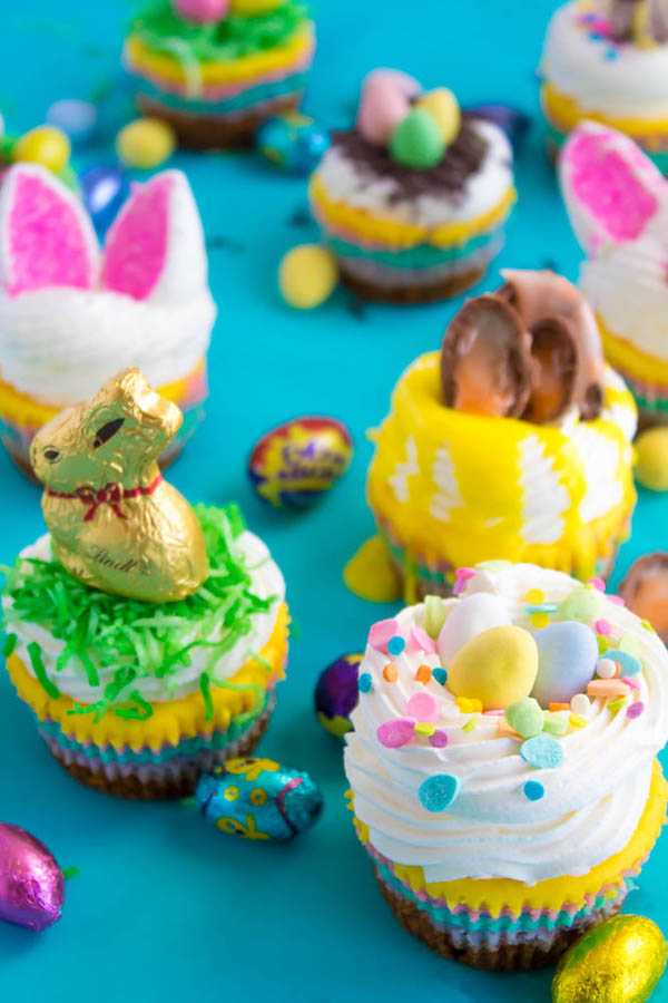 These Mini Easter Cheesecakes are a colourful, fun, festive Easter and Spring treat! Creamy, pastel layered mini cheesecakes topped with yummy Easter candy!