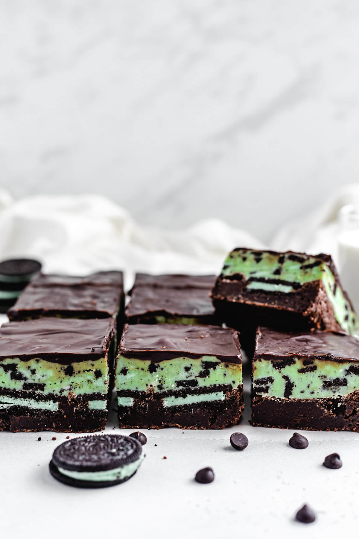 row of brownies topped with fudge