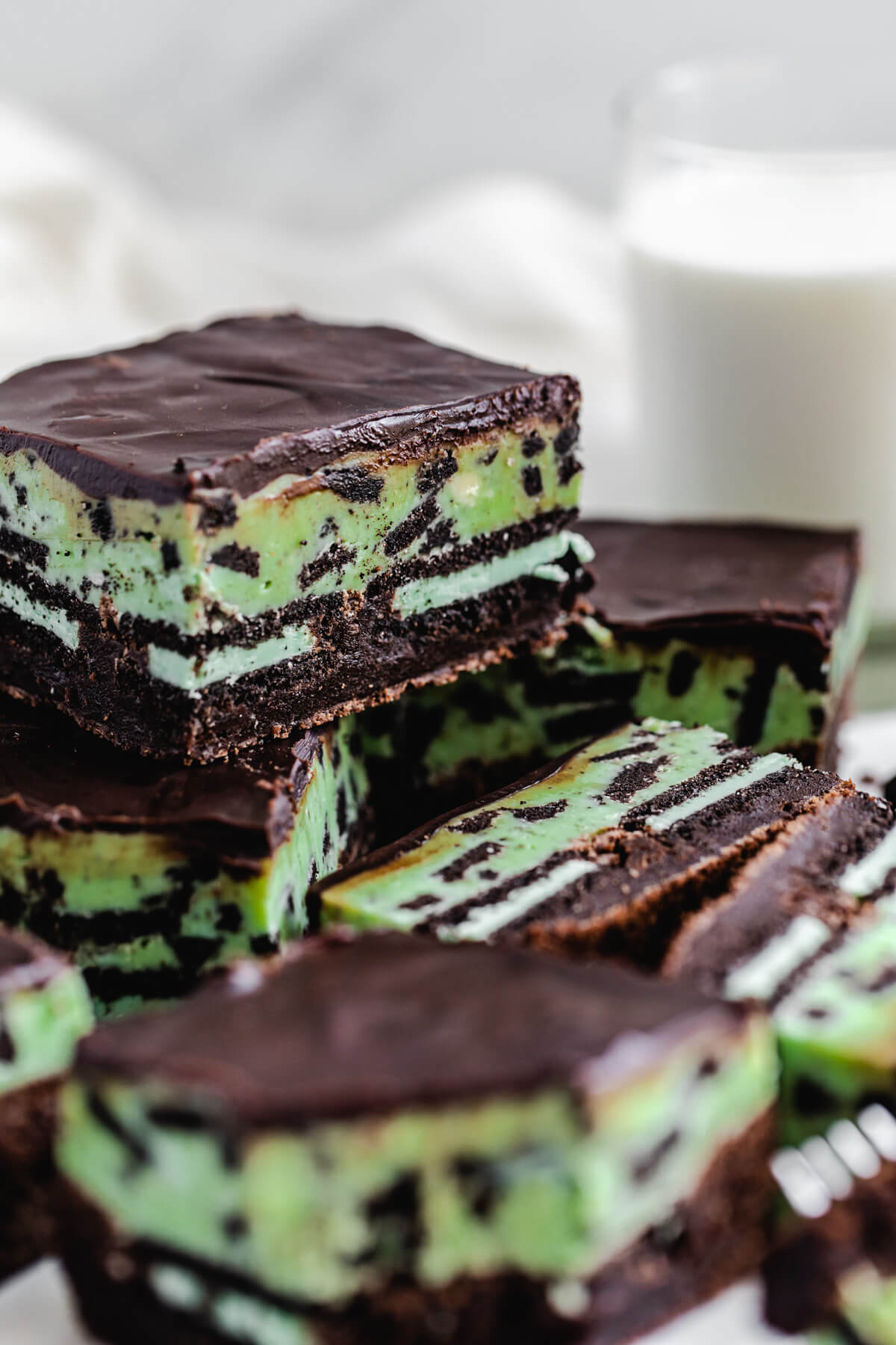 close up of brownie on top of more brownies