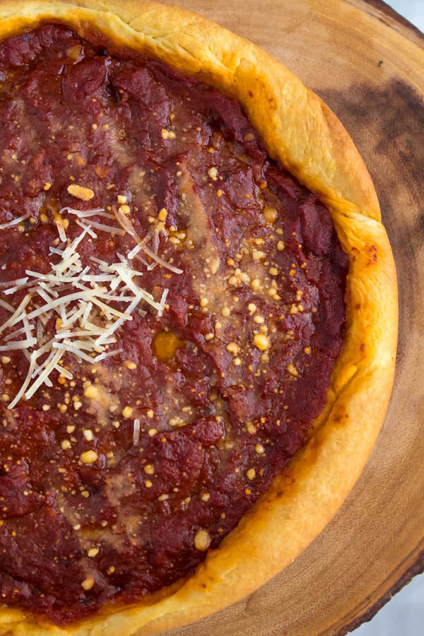 This Chicago Deep Dish Pizza is without a doubt, the best in the world! With it's flaky, buttery deep dish crust, layers of ooey gooey cheeses and customizable toppings, and a thick layer of the most flavourful tomato sauce — no other pizza compares!