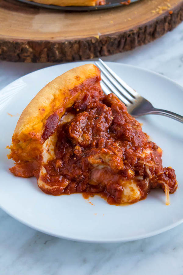 This Chicago Deep Dish Pizza is without a doubt, the best in the world! With it's flaky, buttery deep dish crust, layers of ooey gooey cheeses and customizable toppings, and a thick layer of the most flavourful tomato sauce — no other pizza compares!