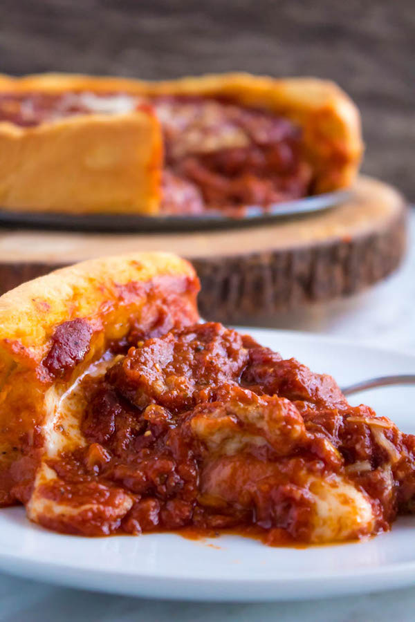 This Chicago Deep Dish Pizza is without a doubt, the best in the world! With it's flaky, buttery deep dish crust, layers of ooey gooey cheeses and customizable toppings, and a thick layer of the most flavourful tomato sauce — no other pizza compares!