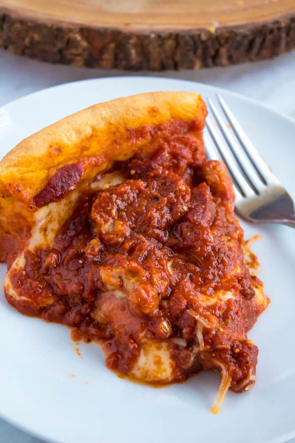 This Chicago Deep Dish Pizza is without a doubt, the best in the world! With it's flaky, buttery deep dish crust, layers of ooey gooey cheeses and customizable toppings, and a thick layer of the most flavourful tomato sauce — no other pizza compares!