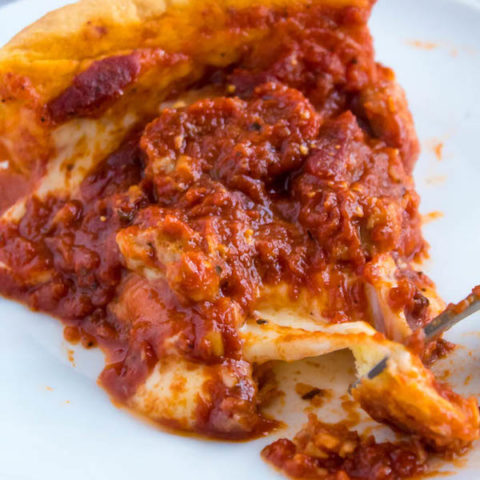 Craving Chicago pizza, but don't live in Chicago? Well good news — It's super easy to make at home! This Chicago Deep Dish Pizza is without a doubt, the best in the world! With it's flaky, buttery deep dish crust, layers of ooey gooey cheeses and customizable toppings, and a thick layer of the most flavourful tomato sauce — no other pizza compares!