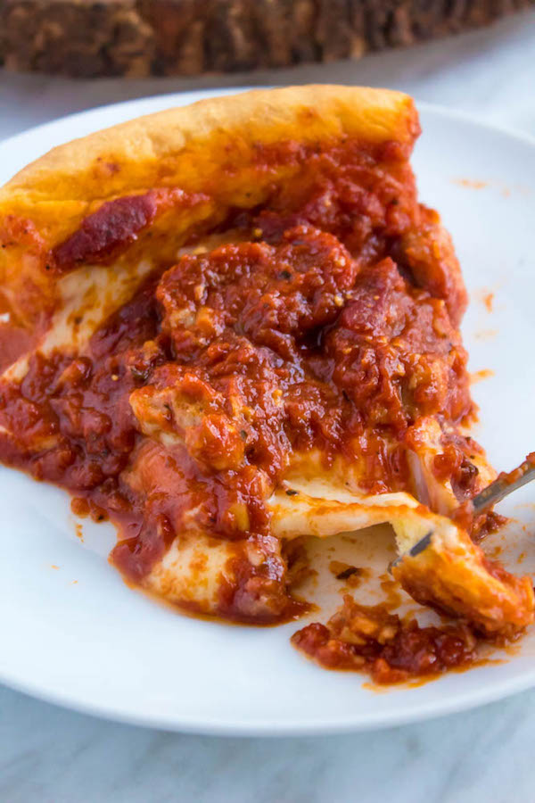 Craving Chicago pizza, but don't live in Chicago? Well good news — It's super easy to make at home! This Chicago Deep Dish Pizza is without a doubt, the best in the world! With it's flaky, buttery deep dish crust, layers of ooey gooey cheeses and customizable toppings, and a thick layer of the most flavourful tomato sauce — no other pizza compares!