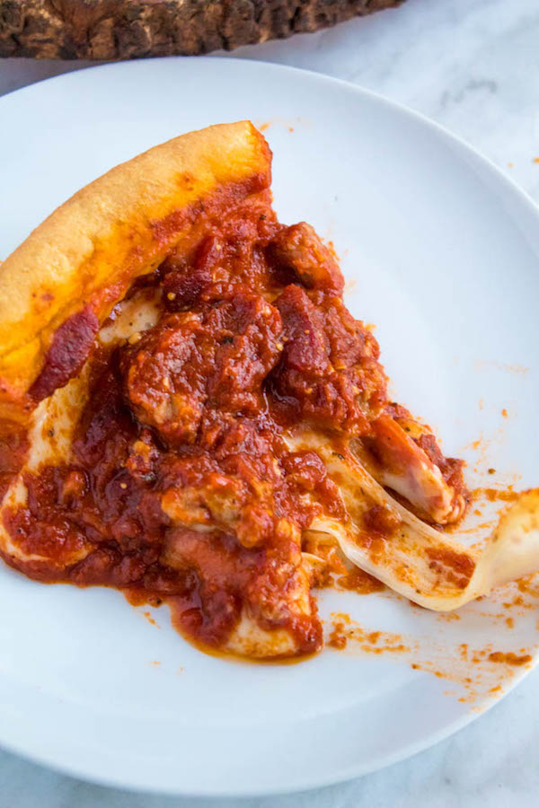 This Chicago Deep Dish Pizza is without a doubt, the best in the world! With it's flaky, buttery deep dish crust, layers of ooey gooey cheeses and customizable toppings, and a thick layer of the most flavourful tomato sauce — no other pizza compares!