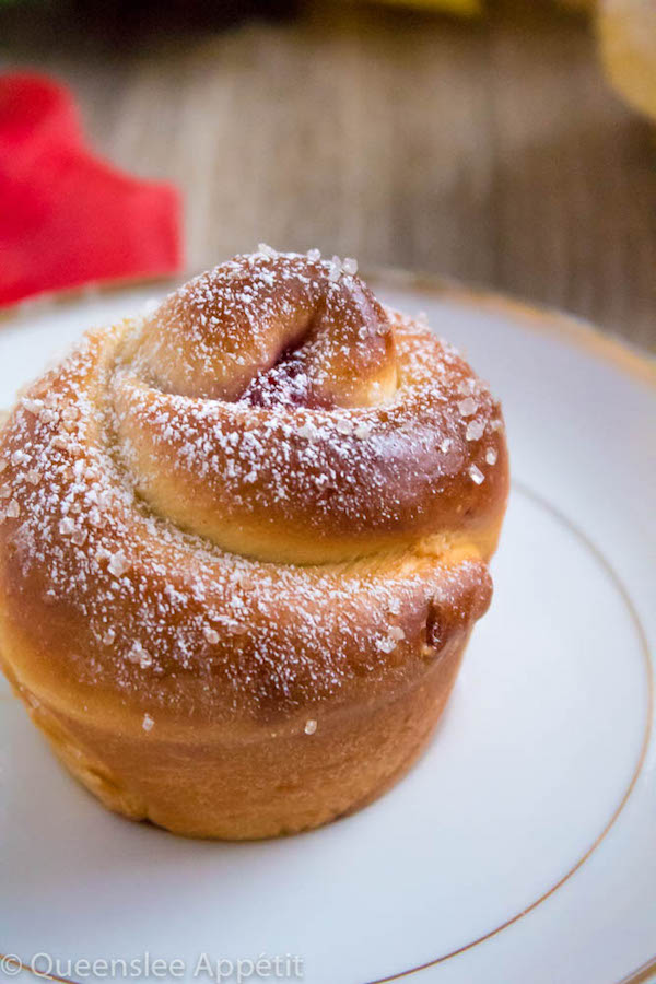 Wake up and smell the rose buns! Soft and fluffy rose-shaped buns filled with sweet raspberry jam. These Raspberry Rose Buns are an easy and gorgeous gift for Mothers Day! 