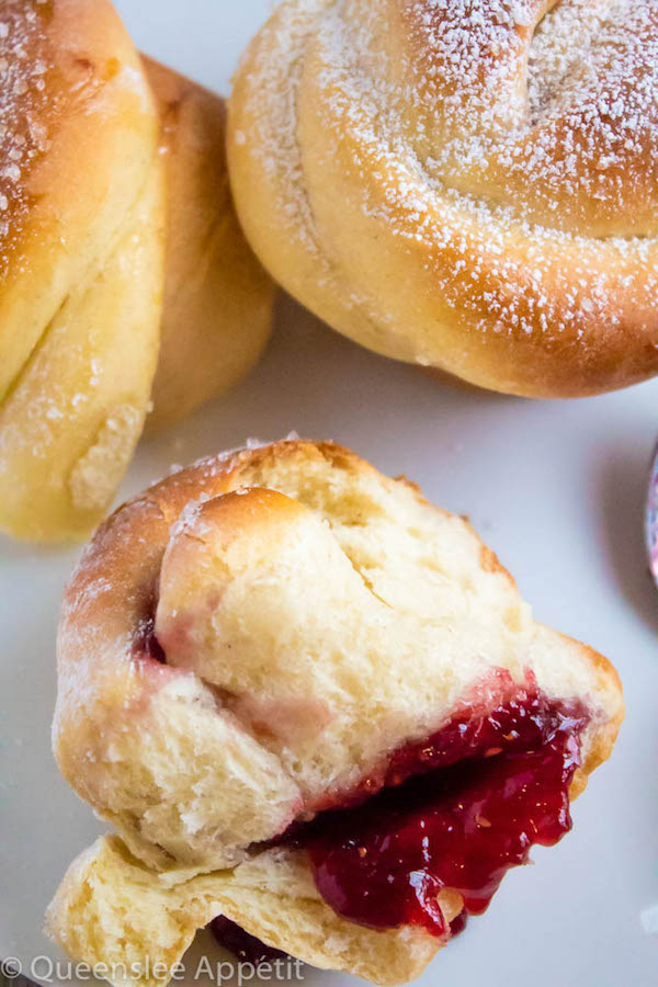 Wake up and smell the rose buns! Soft and fluffy rose-shaped buns filled with sweet raspberry jam. These Raspberry Rose Buns are an easy and gorgeous gift for Mothers Day! 