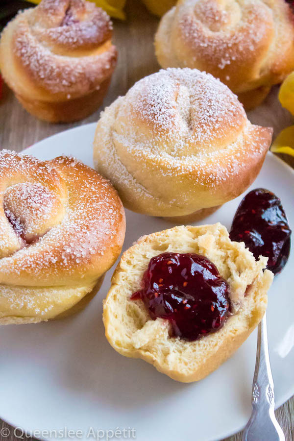 Wake up and smell the rose buns! Soft and fluffy rose-shaped buns filled with sweet raspberry jam. These Raspberry Rose Buns are an easy and gorgeous gift for Mothers Day! 