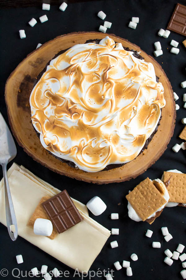 Mississippi Mud Pie with a S’mores twist! This decadent S’mores Mississippi Mud Pie combines the classic campfire treat with a traditional Mississippi Mud pie. With a buttery graham cracker crust, fudgy brownie base, thick and rich dark chocolate pudding with marshmallows mixed in, then topped off with a fluffy toasted meringue — this summer dessert is to die for! 