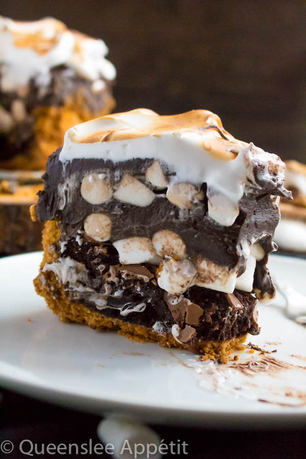Mississippi Mud Pie with a S’mores twist! This decadent S’mores Mississippi Mud Pie combines the classic campfire treat with a traditional Mississippi Mud pie. With a buttery graham cracker crust, fudgy brownie base, thick and rich dark chocolate pudding with marshmallows mixed in, then topped off with a fluffy toasted meringue — this summer dessert is to die for! 