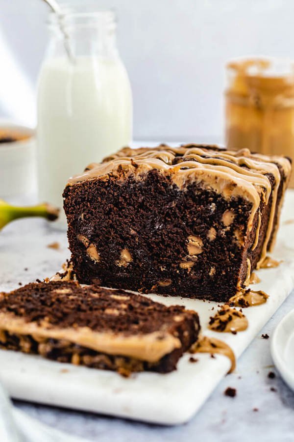 half of chocolate banana loaf on a Marble platter