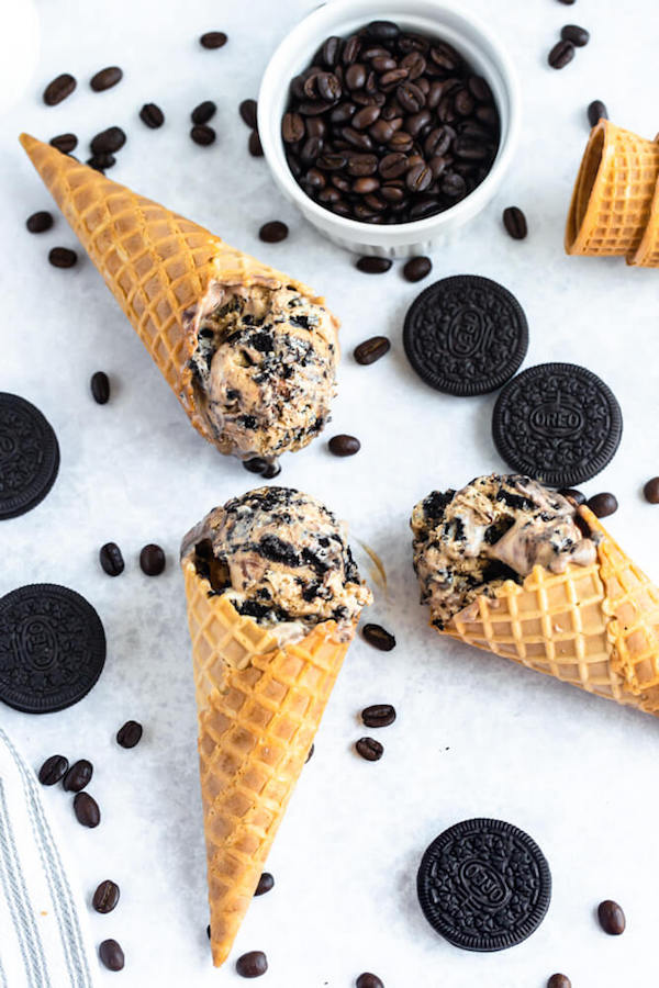 no-churn coffee ice cream with chunks of Oreo and a swirl of Nutella ganache in waffle cones