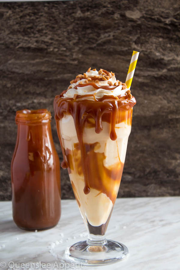 This Salted Caramel Milkshake is made with creamy vanilla ice cream and homemade salted caramel sauce. Topped with fluffy whipped cream, extra salted caramel sauce and toffee bits — this is the perfect chilly drink to indulge in this summer! 