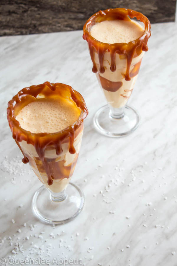 This Salted Caramel Milkshake is made with creamy vanilla ice cream and homemade salted caramel sauce. Topped with fluffy whipped cream, extra salted caramel sauce and toffee bits — this is the perfect chilly drink to indulge in this summer! 