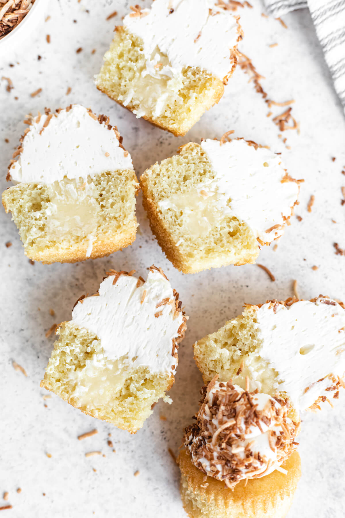 halved cupcakes with coconut filling