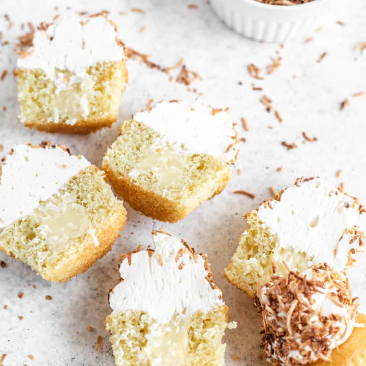 six halved cupcakes coated in coconut