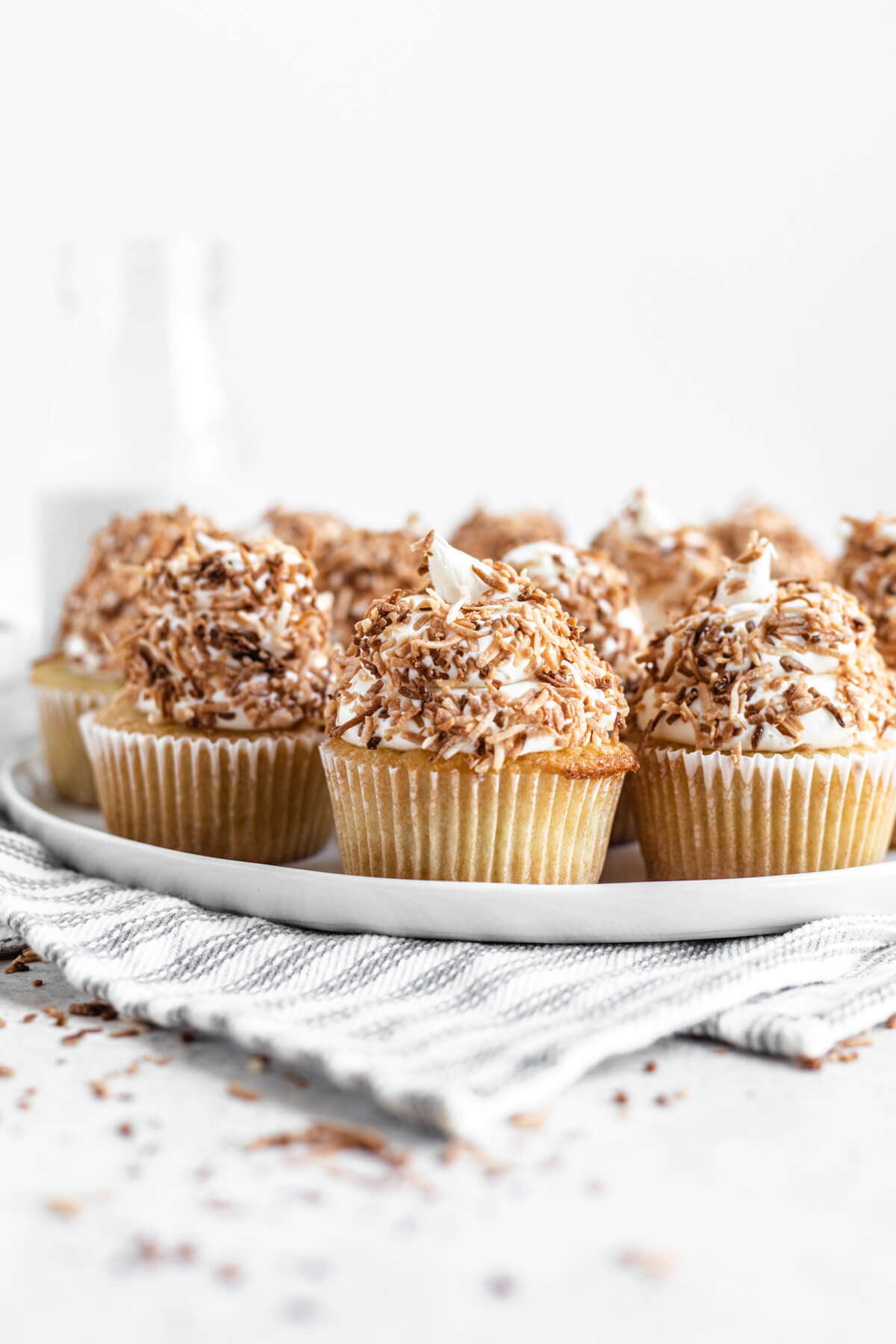 coconut flavoured cupcakes on a white plate