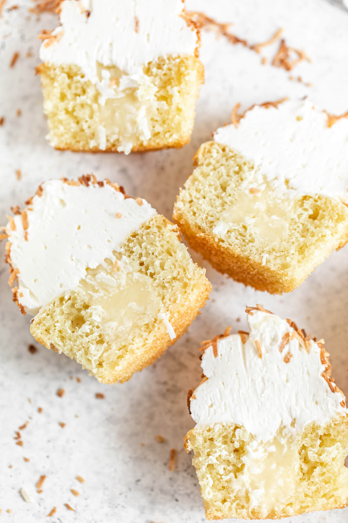 close up halved cupcakes with custard filling