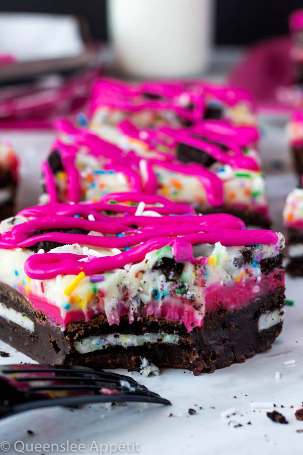 These Birthday Cake Oreo Fudge Brownies are super rich and decadent. Layers of fudgy Birthday Cake Oreo stuffed brownies and Funfetti fudge are topped with more Oreos and plenty of sprinkles. Drizzle these bars with hot pink candy melts and you’ve got a party in a brownie!