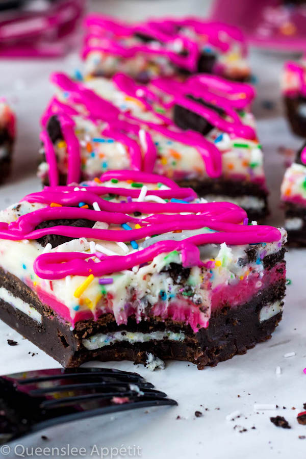 These Birthday Cake Oreo Fudge Brownies are super rich and decadent. Layers of fudgy Birthday Cake Oreo stuffed brownies and Funfetti fudge are topped with more Oreos and plenty of sprinkles. Drizzle these bars with hot pink candy melts and you’ve got a party in a brownie!