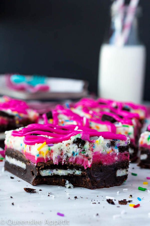 These Birthday Cake Oreo Fudge Brownies are super rich and decadent. Layers of fudgy Birthday Cake Oreo stuffed brownies and Funfetti fudge are topped with more Oreos and plenty of sprinkles. Drizzle these bars with hot pink candy melts and you’ve got a party in a brownie!