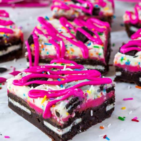 These Birthday Cake Oreo Fudge Brownies are super rich and decadent. Layers of fudgy Birthday Cake Oreo stuffed brownies and Funfetti fudge are topped with more Oreos and plenty of sprinkles. Drizzle these bars with hot pink candy melts and you’ve got a party in a brownie!