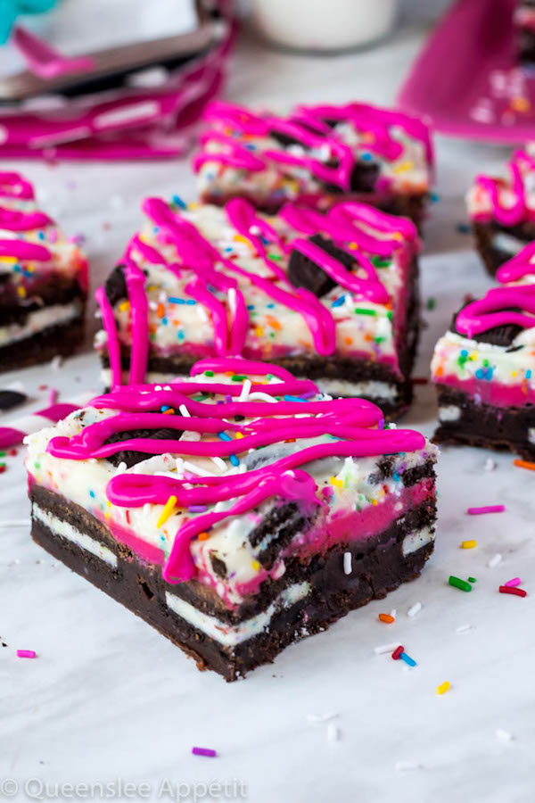 These Birthday Cake Oreo Fudge Brownies are super rich and decadent. Layers of fudgy Birthday Cake Oreo stuffed brownies and Funfetti fudge are topped with more Oreos and plenty of sprinkles. Drizzle these bars with hot pink candy melts and you’ve got a party in a brownie!