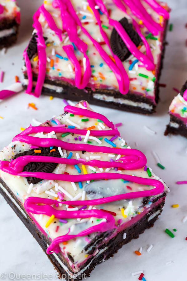 These Birthday Cake Oreo Fudge Brownies are super rich and decadent. Layers of fudgy Birthday Cake Oreo stuffed brownies and Funfetti fudge are topped with more Oreos and plenty of sprinkles. Drizzle these bars with hot pink candy melts and you’ve got a party in a brownie!