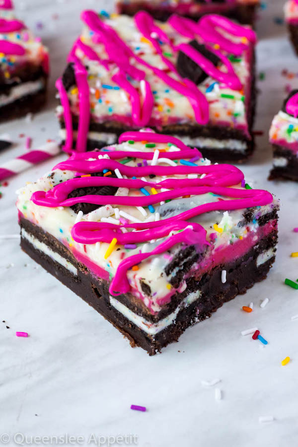 These Birthday Cake Oreo Fudge Brownies are super rich and decadent. Layers of fudgy Birthday Cake Oreo stuffed brownies and Funfetti fudge are topped with more Oreos and plenty of sprinkles. Drizzle these bars with hot pink candy melts and you’ve got a party in a brownie!