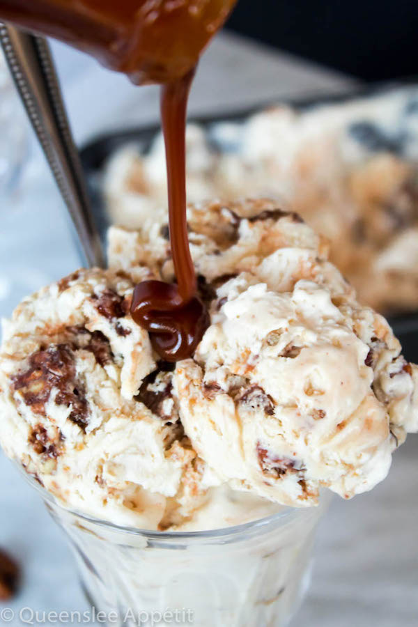 This No-Churn Candied Pecan Caramel Swirl Ice Cream starts with a simple creamy vanilla ice cream. Mix in chunks of crunchy, sweet candied pecan pieces and swirl in a ribbon of silky homemade caramel sauce for a super easy summer treat! 