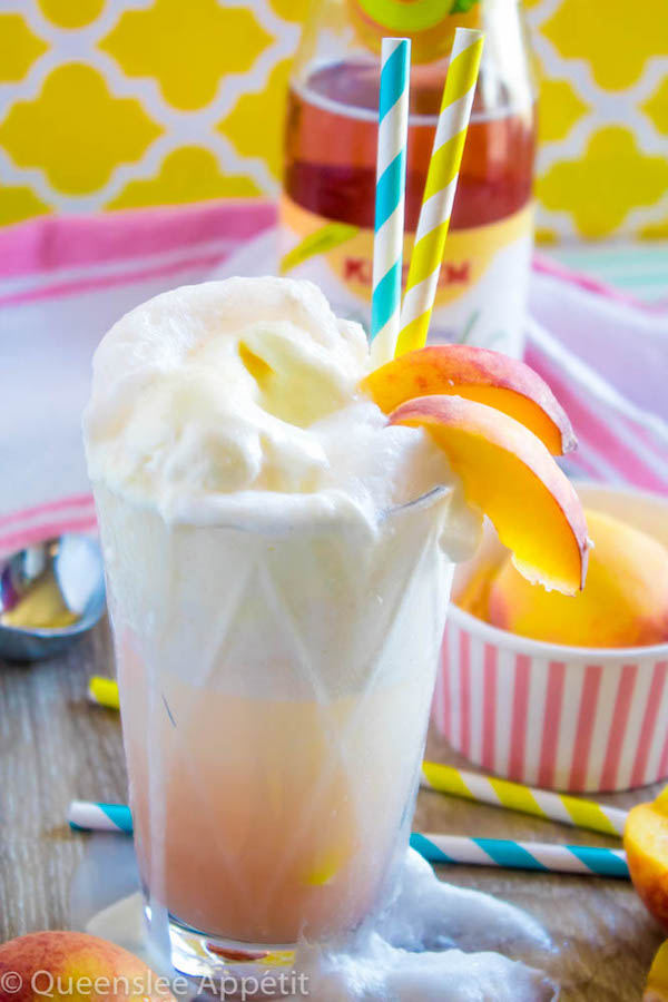 These Peaches and Cream Floats are a super delicious and refreshing drink. Scoops of creamy vanilla ice cream topped with a sparkling peach beverage and club soda. This fizzy drink is perfect for a hot summer day!  