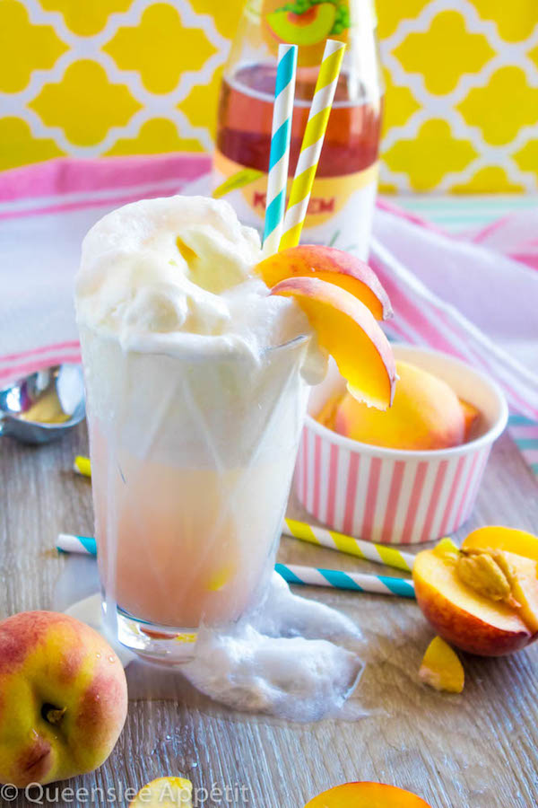 These Peaches and Cream Floats are a super delicious and refreshing drink. Scoops of creamy vanilla ice cream topped with a sparkling peach beverage and club soda. This fizzy drink is perfect for a hot summer day!  