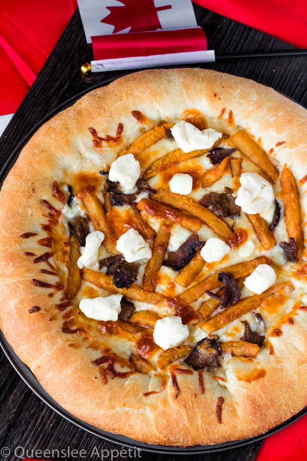 This classic Canadian dish just got better! This Poutine Pizza is topped with poutine gravy, shredded mozzarella and white cheddar cheese, crispy fries, steak and chunks of white cheddar cheese curds! To take it to the next level, the crust is stuffed with cheese! 