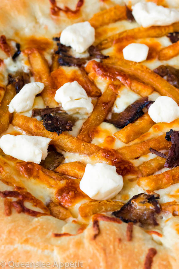 This classic Canadian dish just got better! This Poutine Pizza is topped with poutine gravy, shredded mozzarella and white cheddar cheese, crispy fries, steak and chunks of white cheddar cheese curds! To take it to the next level, the crust is stuffed with cheese! 