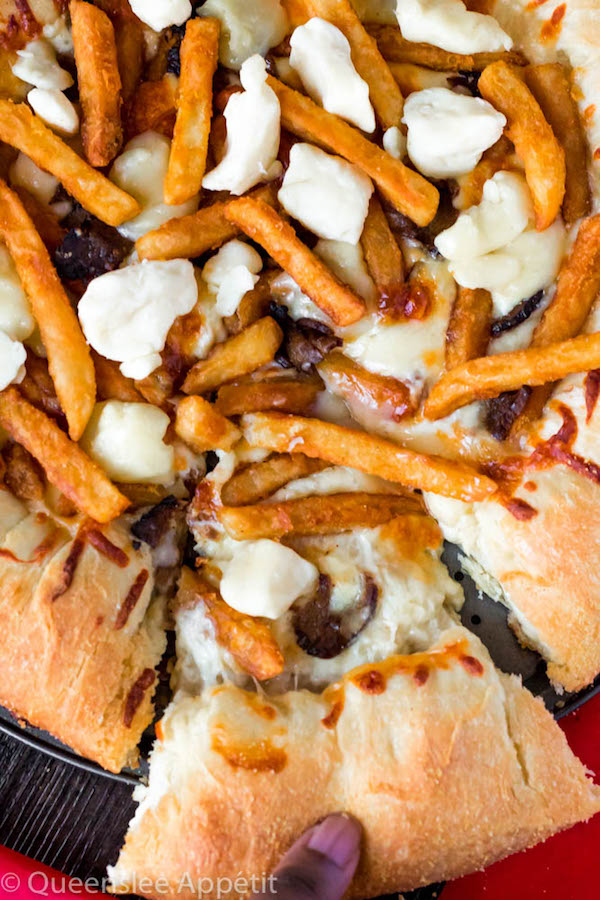 This classic Canadian dish just got better! This Poutine Pizza is topped with poutine gravy, shredded mozzarella and white cheddar cheese, crispy fries, steak and chunks of white cheddar cheese curds! To take it to the next level, the crust is stuffed with cheese! 