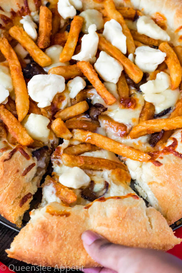 This classic Canadian dish just got better! This Poutine Pizza is topped with poutine gravy, shredded mozzarella and white cheddar cheese, crispy fries, steak and chunks of white cheddar cheese curds! To take it to the next level, the crust is stuffed with cheese! 
