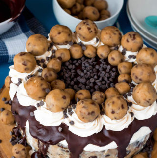 Chocolate Chip Cookie Dough Ice Cream Cake — vanilla ice cream mixed with chocolate chips and edible cookie dough encased in a cookie dough crust and topped with ganache, whipped cream and more cookie dough! 