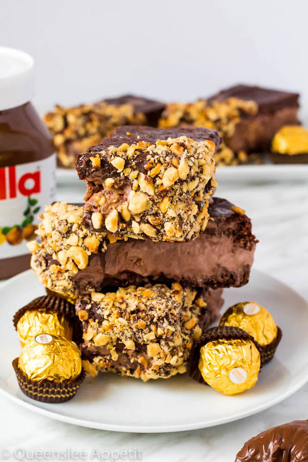 These Nutella Brownie Ice Cream Sandwiches feature Ferrero Rocher stuffed chocolate ice cream sandwiched between two fudgy Nutella brownies. These lovelies are taken to the next level with a chocolate/hazelnut coating! A fun treat for the summertime! 