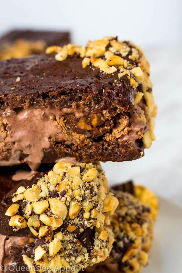 These Nutella Brownie Ice Cream Sandwiches feature Ferrero Rocher stuffed chocolate ice cream sandwiched between two fudgy Nutella brownies. These lovelies are taken to the next level with a chocolate/hazelnut coating! A fun treat for the summertime! 