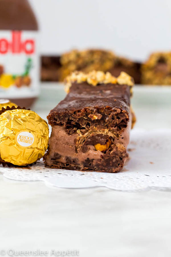 These Nutella Brownie Ice Cream Sandwiches feature Ferrero Rocher stuffed chocolate ice cream sandwiched between two fudgy Nutella brownies. These lovelies are taken to the next level with a chocolate/hazelnut coating! A fun treat for the summertime! 