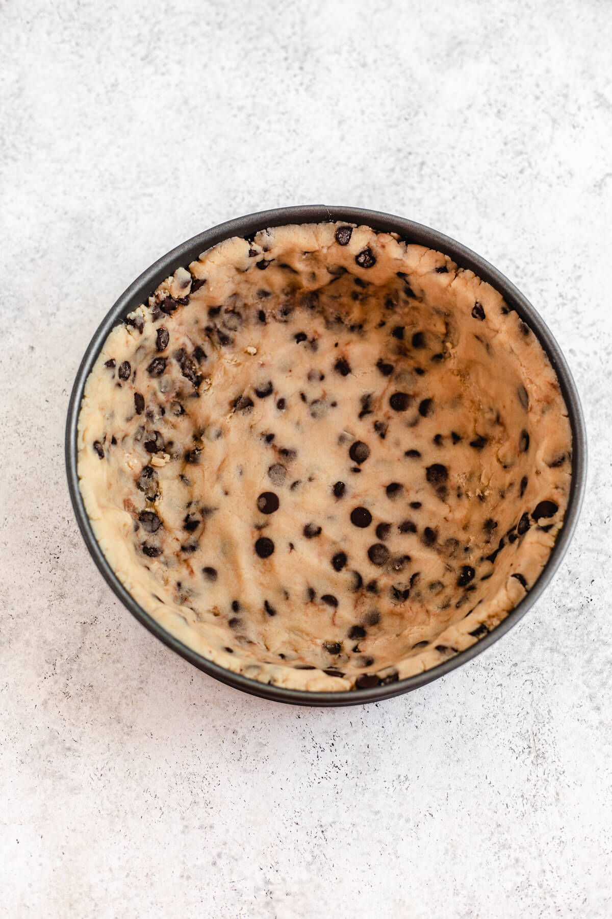 cookie dough in the bottom and up the sides of a springform pan